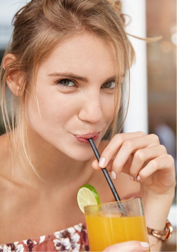 adorable-beautiful-young-female-sips-fresh-orange-2023-11-27-05-21-20-utc