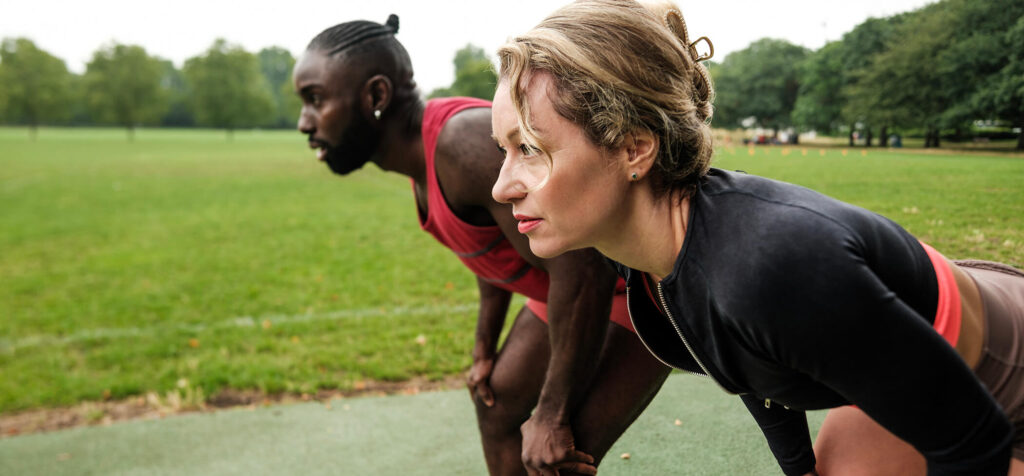 athletes-recovering-after-training-in-a-park-two-2025-09-06-19-57-13-utc
