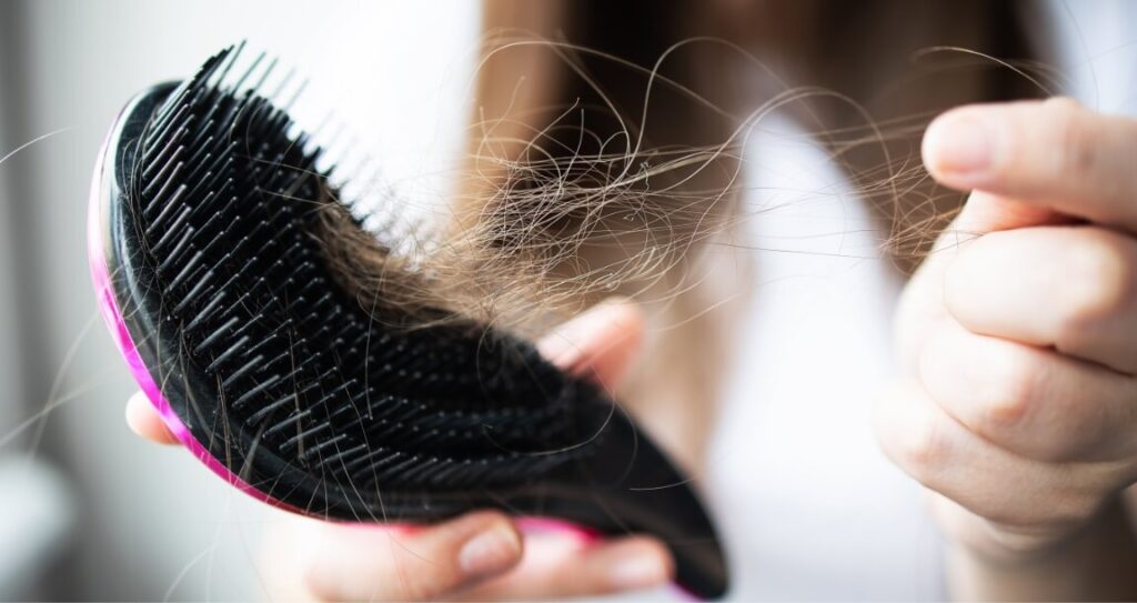close-up-focus-on-the-arm-with-combs-and-hair-2023-11-27-04-52-58-utc (1)